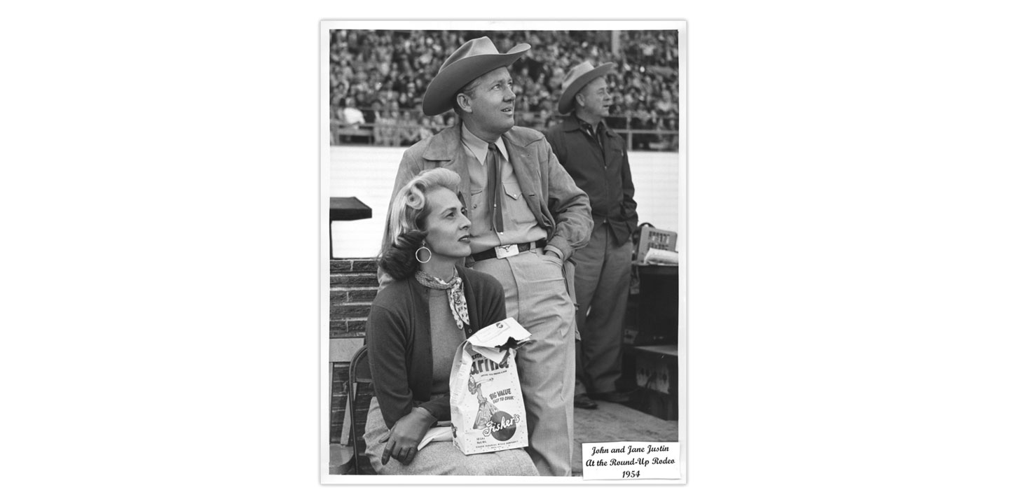 This is a black-and-white photo of Jane and John Justin at the 1954 Puyallup, Washington rodeo. 